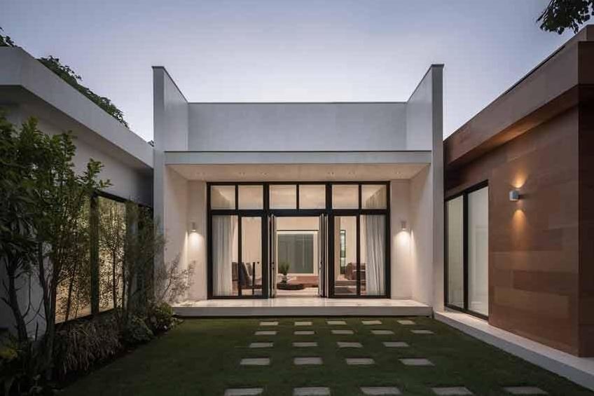 Modern single floor courtyard house design with an open central garden